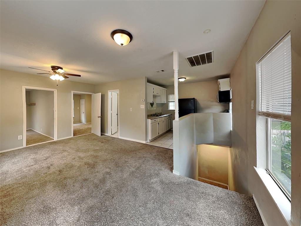 2911 Ryan Avenue Fort Worth, TX 76110 - Photo 18 of 27 a view of a livingroom with furniture and staircase