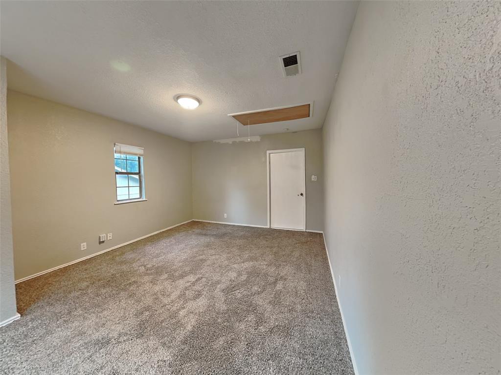 2911 Ryan Avenue Fort Worth, TX 76110 - Photo 23 of 27 a view of an empty room and a window