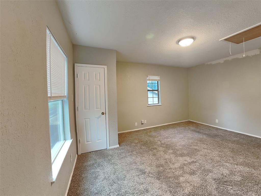 2911 Ryan Avenue Fort Worth, TX 76110 - Photo 24 of 27 an empty room with windows