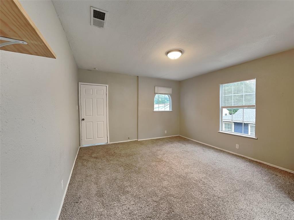 2911 Ryan Avenue Fort Worth, TX 76110 - Photo 25 of 27 an empty room with windows