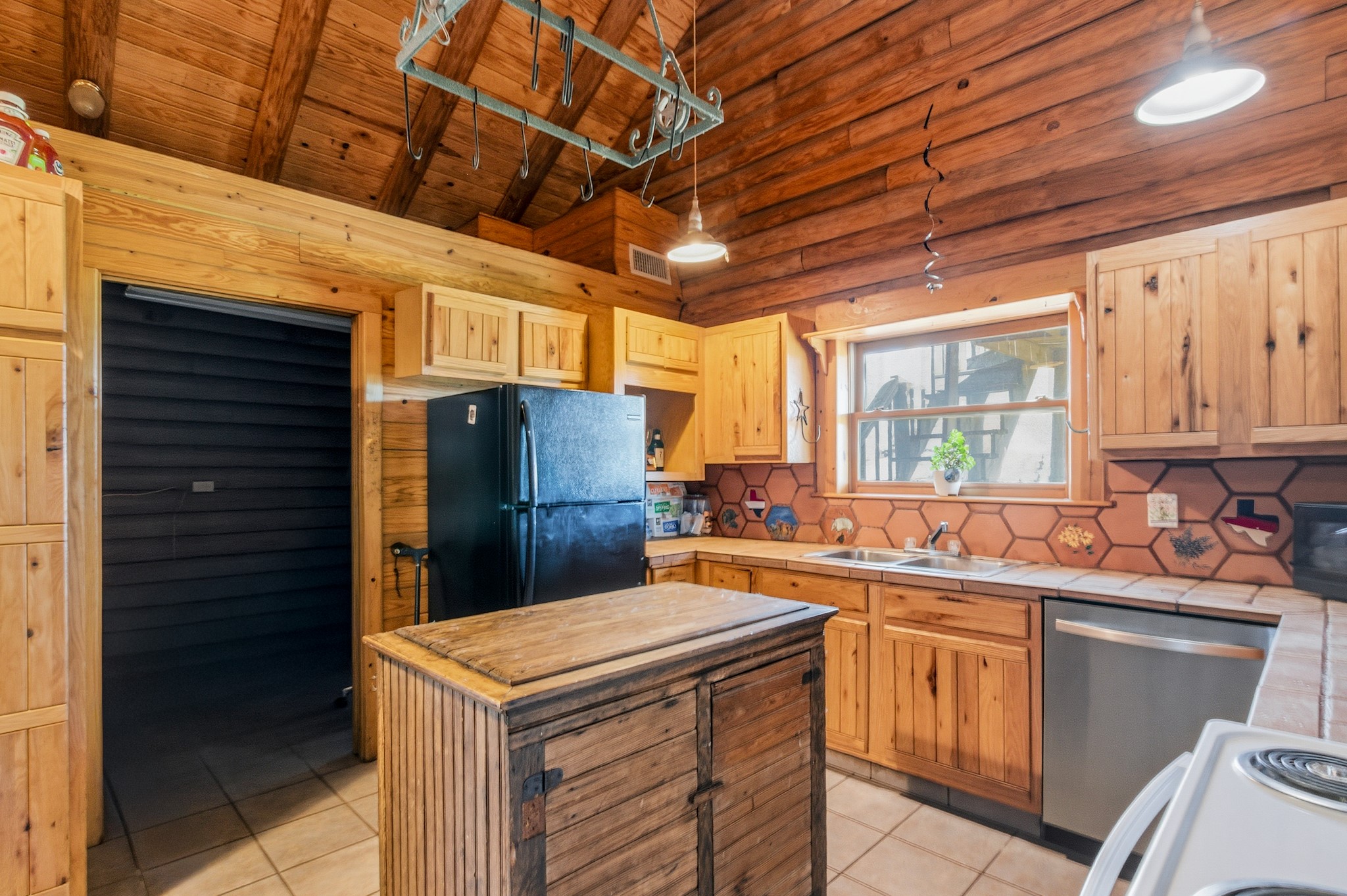 6347 Old Goliad Road Goliad, TX 77963 - Photo 13 of 42 a kitchen that has a sink and a refrigerator