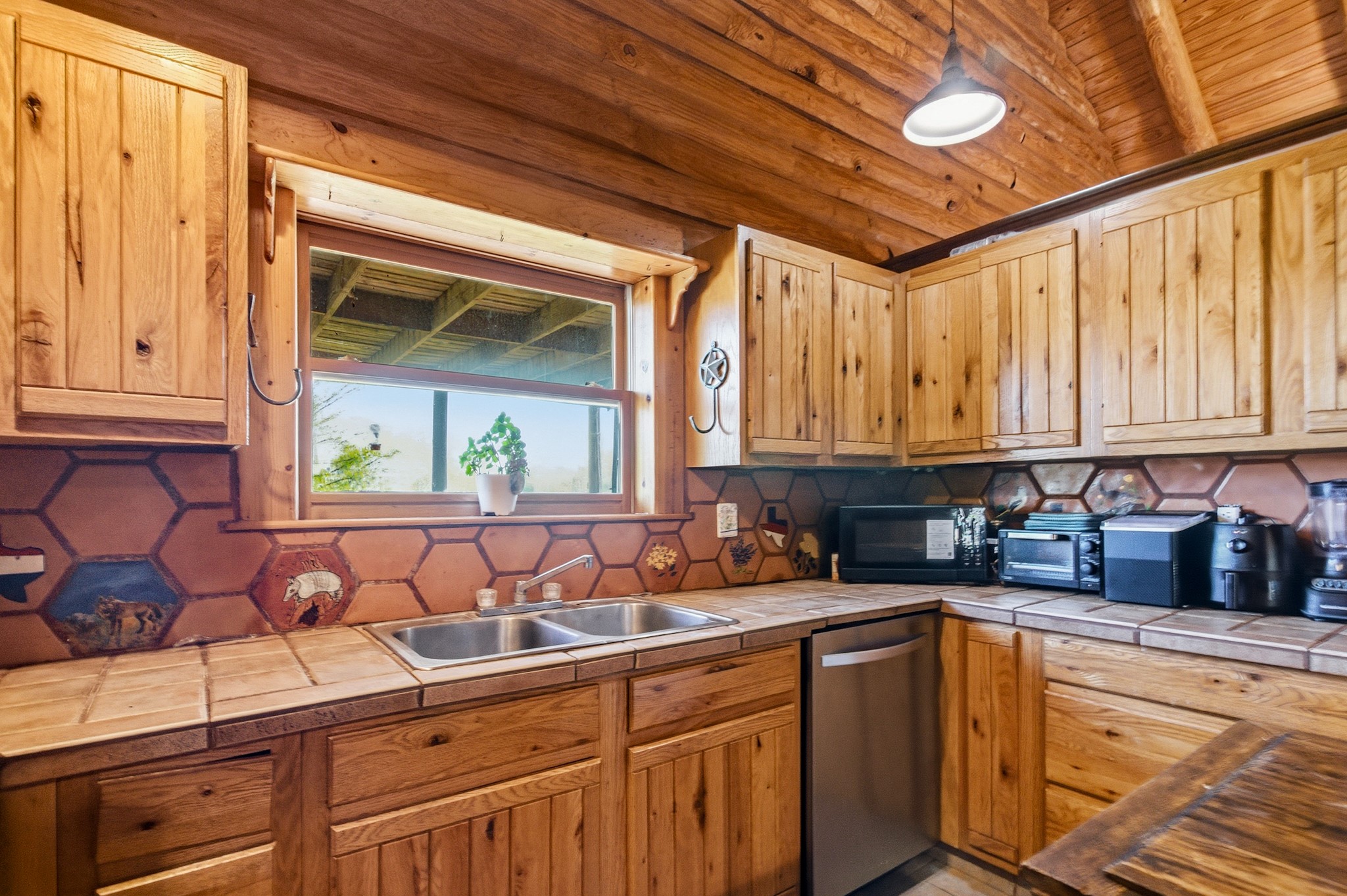 6347 Old Goliad Road Goliad, TX 77963 - Photo 14 of 42 a kitchen with stainless steel appliances granite countertop a sink and cabinets