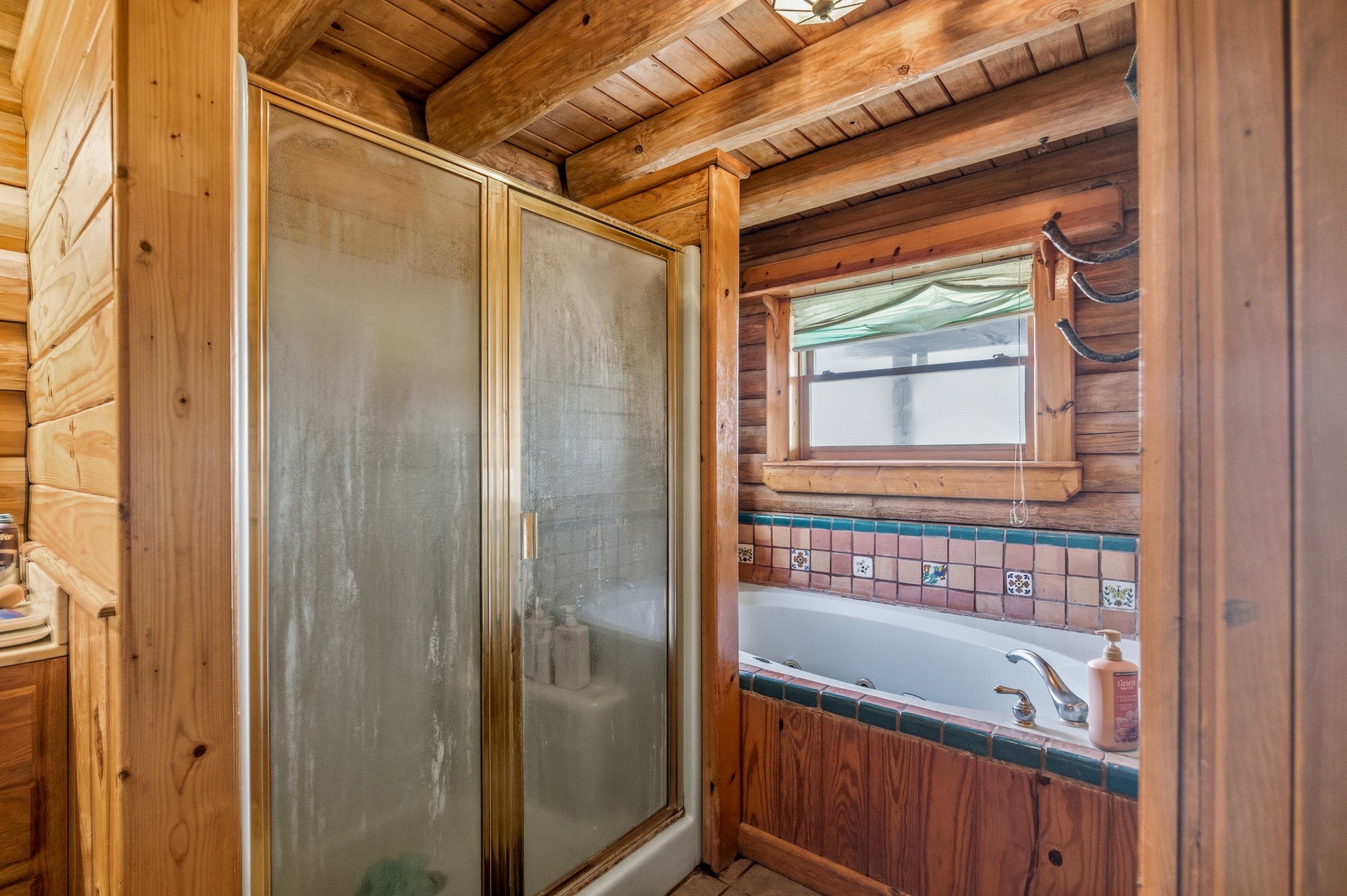 6347 Old Goliad Road Goliad, TX 77963 - Photo 20 of 42 a bathroom with a tub and a shower