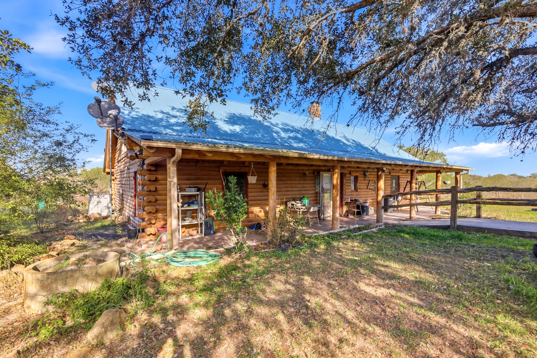 6347 Old Goliad Road Goliad, TX 77963 - Photo 2 of 42 a front view of a house with a garden
