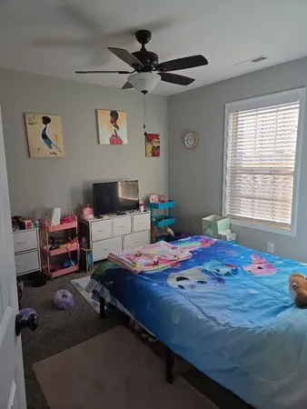 a bed room with a bed furniture and a window