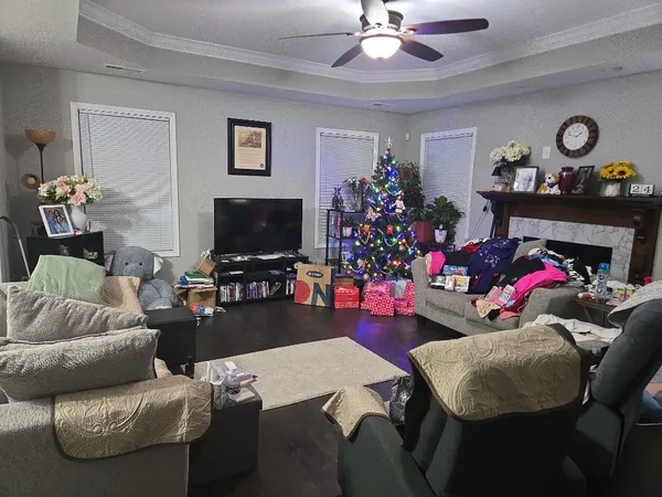 a living room with furniture and a flat screen tv