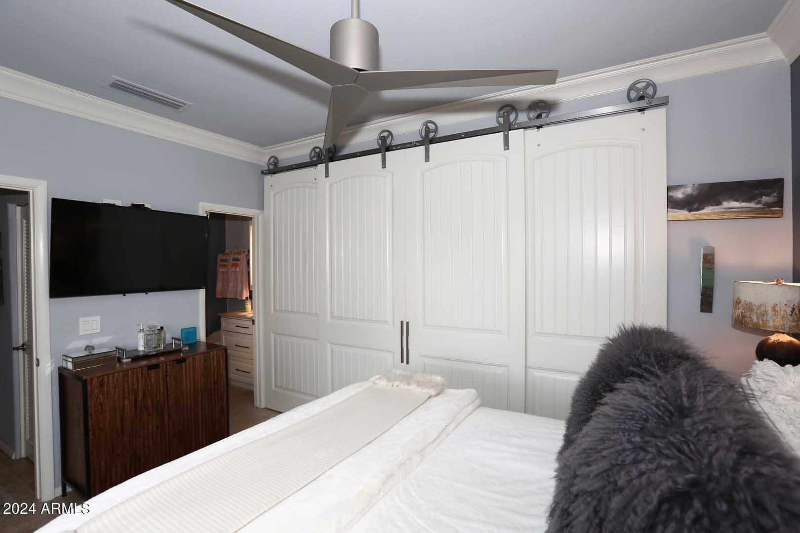 7710 East Gainey Ranch Road, Unit 229 Scottsdale, AZ 85258 - Photo 23 of 49 Primary Bedroom-Barn Doors