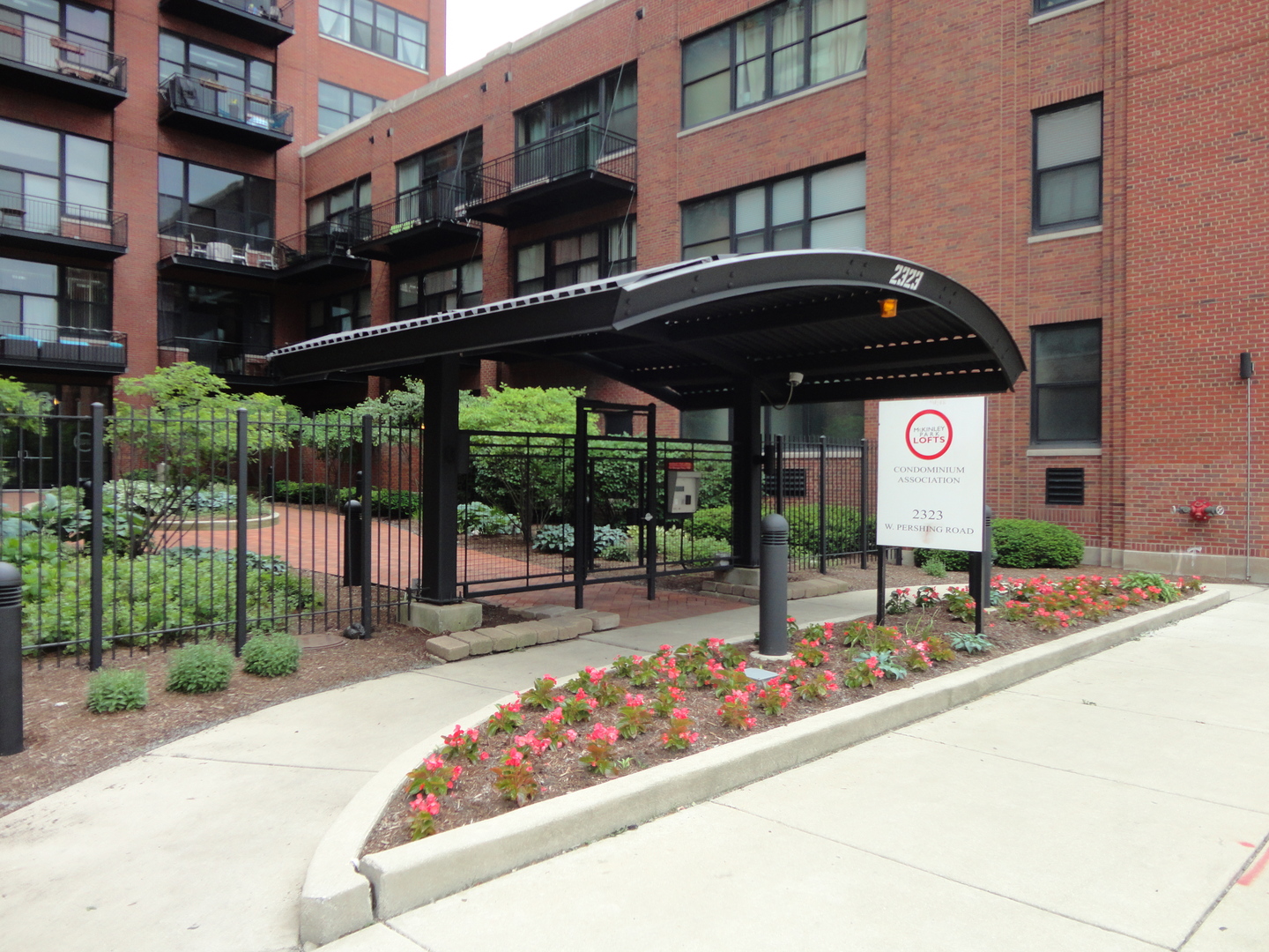2323 West Pershing Road, Unit 136 Chicago, IL 60609 - Photo 2 of 20 a front view of a building with street