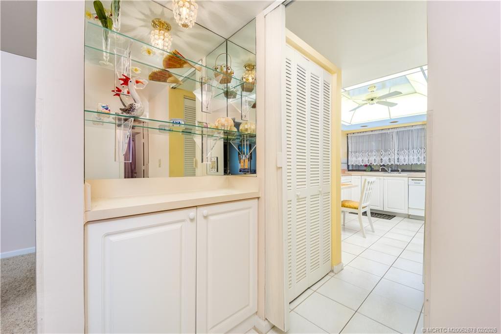 3100 Southeast Pruitt Road, Unit B301 Port St. Lucie, FL 34952 - Photo 20 of 40 Niche storage between dining & Kitchen