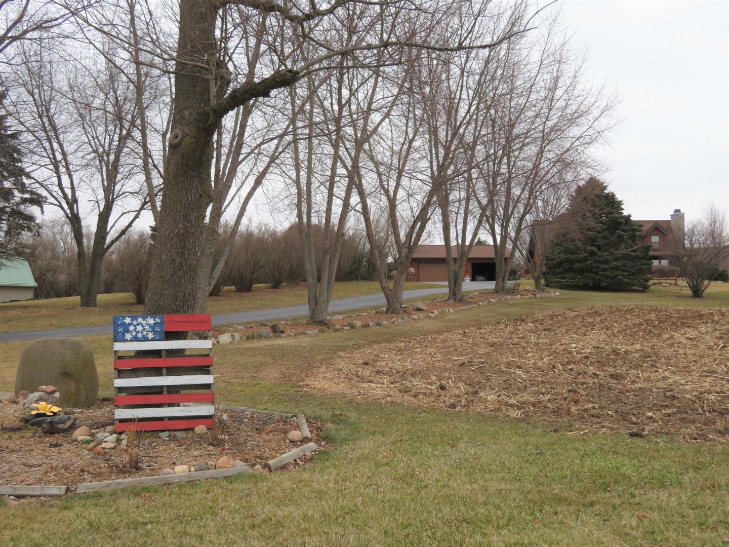 12005 Aldrich Road Sycamore, IL 60178 - Photo 45 of 50 a backyard of a house with trees and outdoor seating