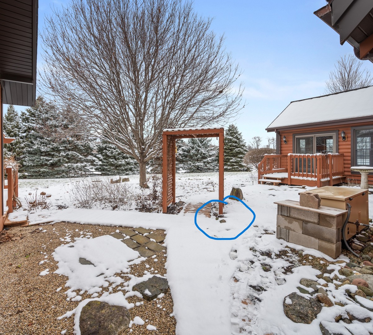 12005 Aldrich Road Sycamore, IL 60178 - Photo 49 of 50 a patio with a wooden fence and trees