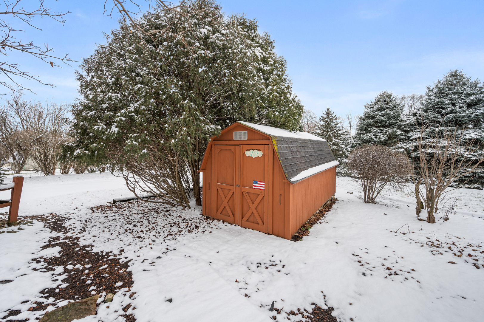 12005 Aldrich Road Sycamore, IL 60178 - Photo 5 of 50 a view of a yard covered in snow