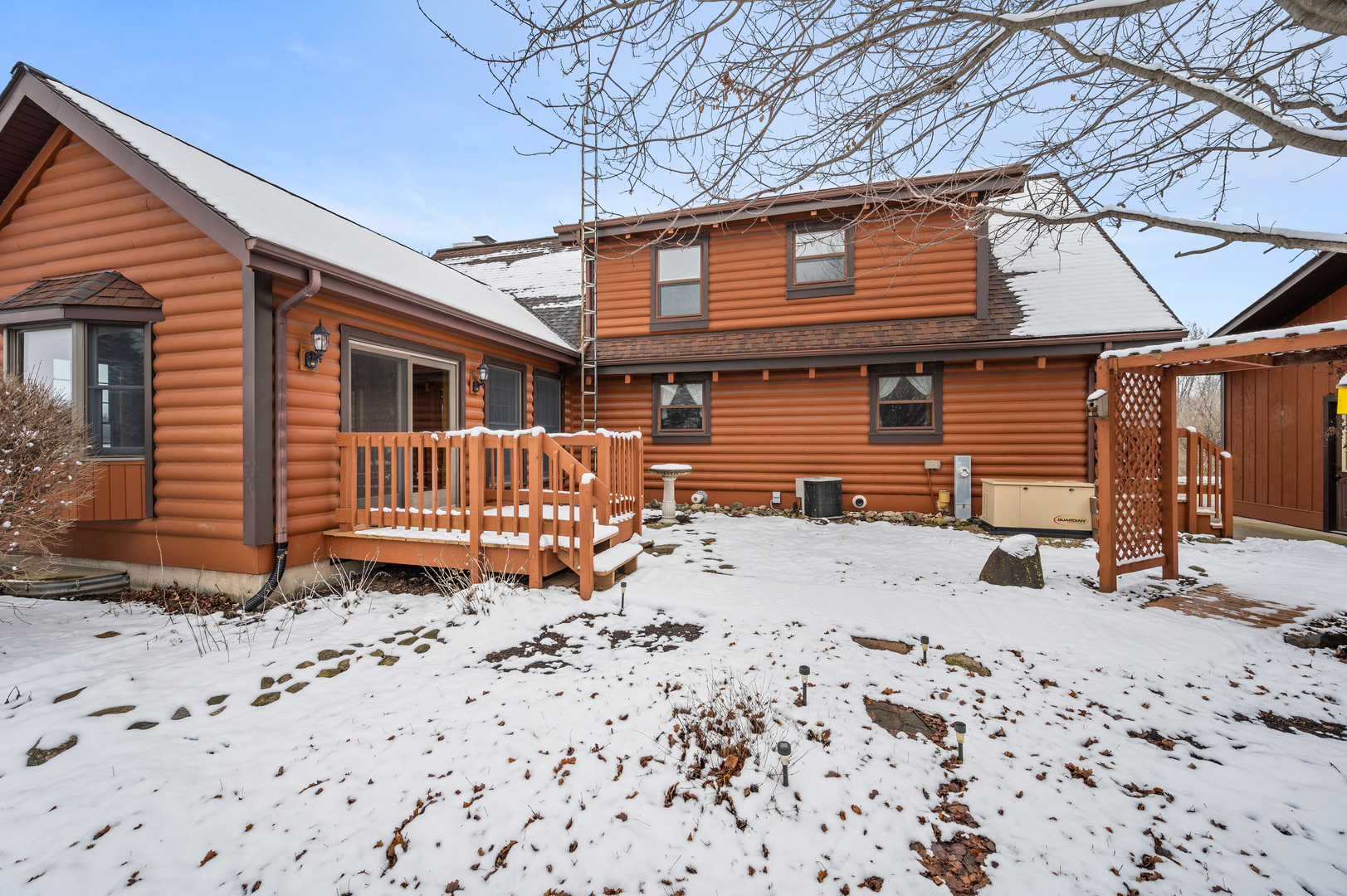 12005 Aldrich Road Sycamore, IL 60178 - Photo 10 of 50 a front view of a house with a yard covered in snow