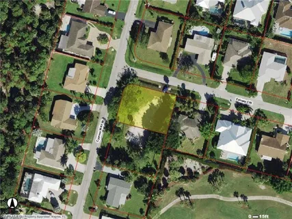 an aerial view of houses with outdoor space