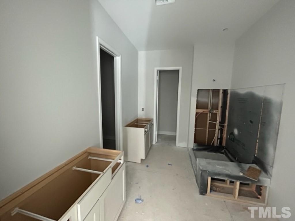 115 Cackling Way Zebulon, NC 27597 - Photo 12 of 44 a room with a chair and appliances