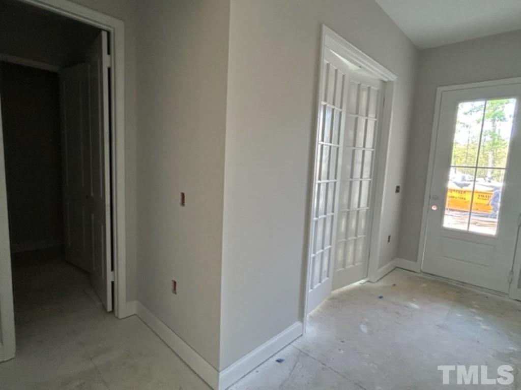 115 Cackling Way Zebulon, NC 27597 - Photo 15 of 44 an empty room with windows