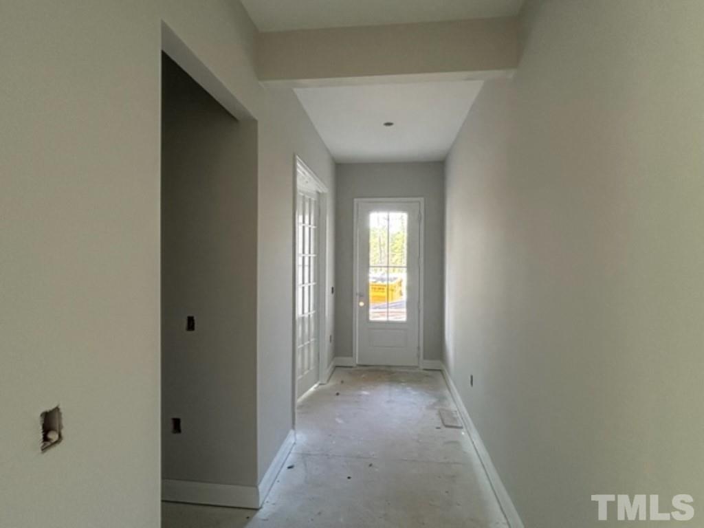 115 Cackling Way Zebulon, NC 27597 - Photo 16 of 44 a view of hallway with windows