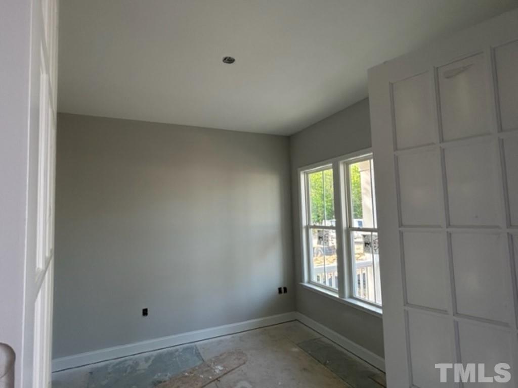 115 Cackling Way Zebulon, NC 27597 - Photo 17 of 44 a view of an empty room with a window