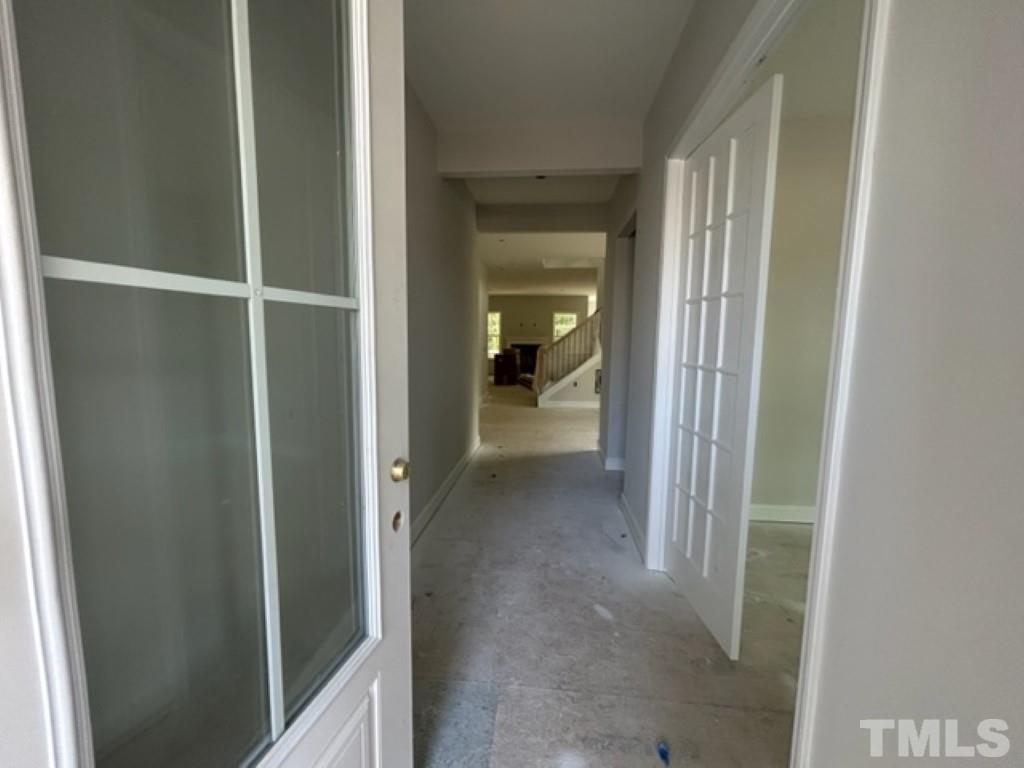 115 Cackling Way Zebulon, NC 27597 - Photo 19 of 44 a view of a bathroom from a corridor