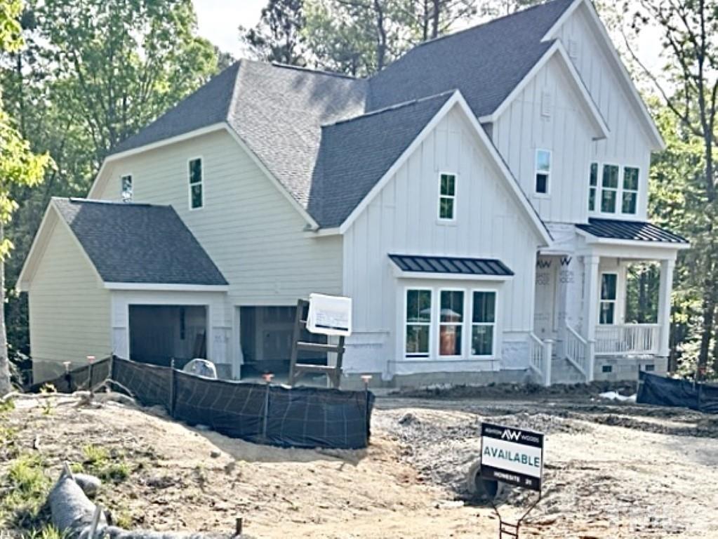 115 Cackling Way Zebulon, NC 27597 - Photo 2 of 44 front view of a house with a yard