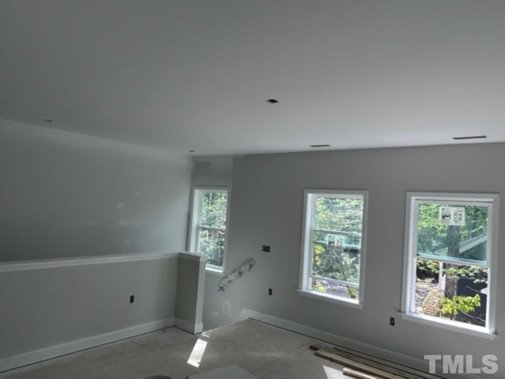 115 Cackling Way Zebulon, NC 27597 - Photo 22 of 44 a view of an empty room with a window