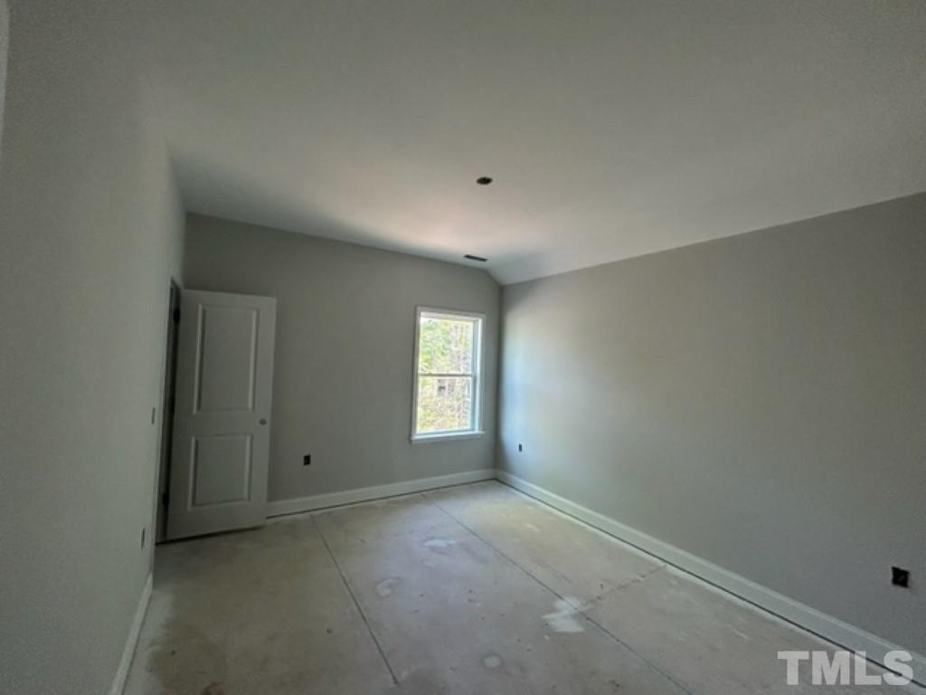 115 Cackling Way Zebulon, NC 27597 - Photo 23 of 44 a view of empty room with window
