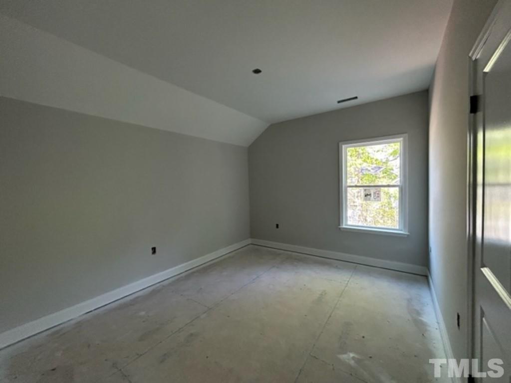 115 Cackling Way Zebulon, NC 27597 - Photo 24 of 44 an empty room with a window