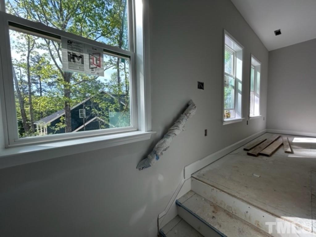 115 Cackling Way Zebulon, NC 27597 - Photo 29 of 44 a view of a room that has a window and wooden floor