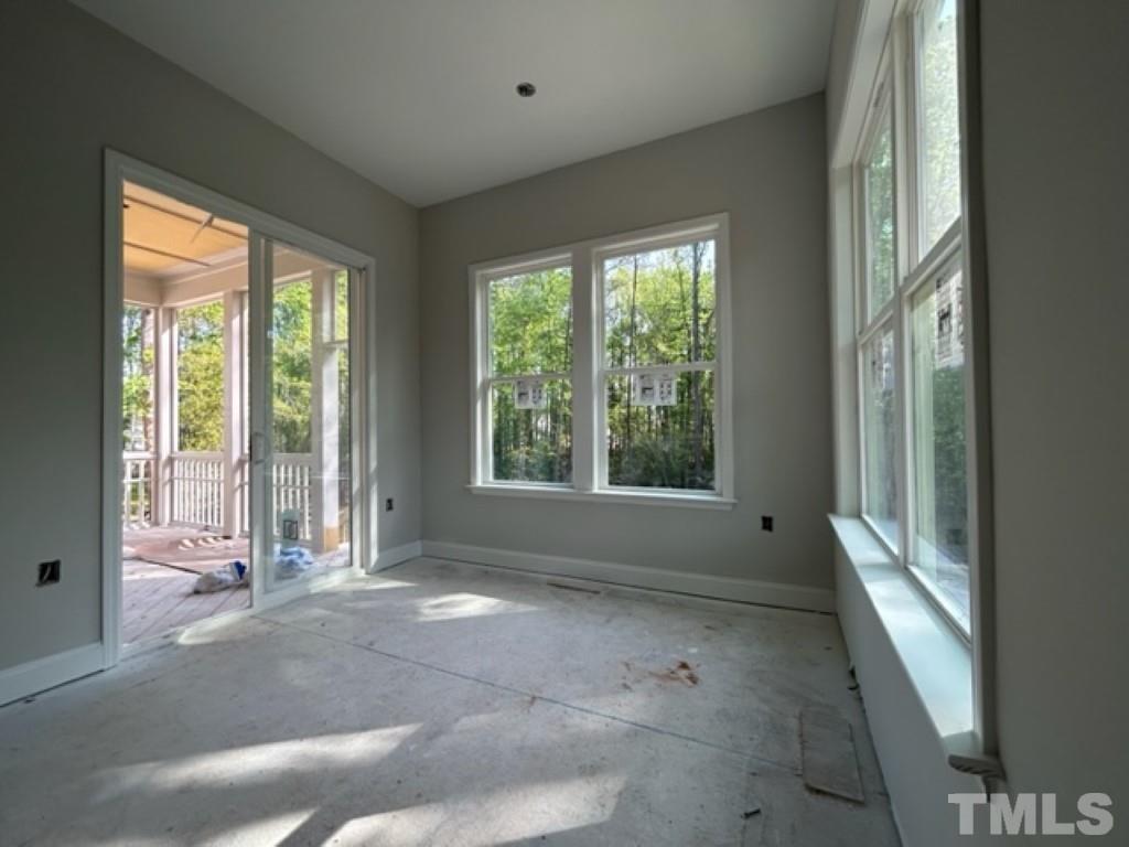 115 Cackling Way Zebulon, NC 27597 - Photo 32 of 44 a view of a room with large windows