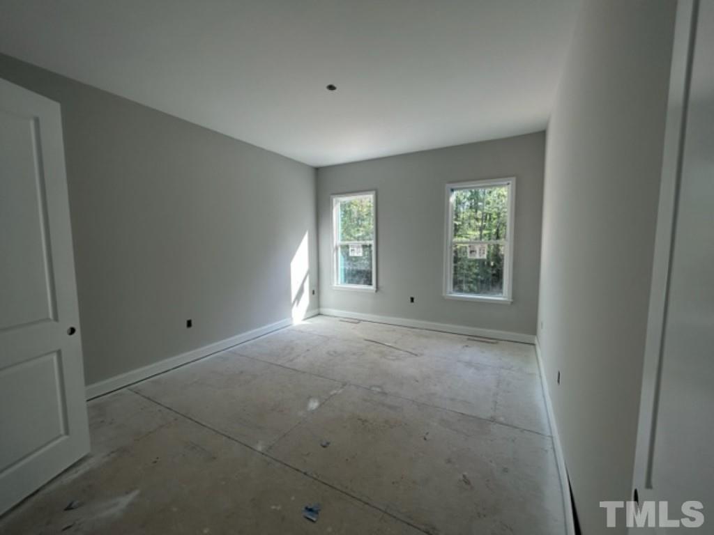 115 Cackling Way Zebulon, NC 27597 - Photo 33 of 44 an empty room with windows and closet