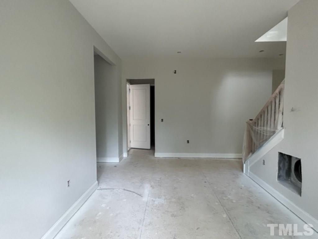 115 Cackling Way Zebulon, NC 27597 - Photo 34 of 44 a view of an empty room with stairs