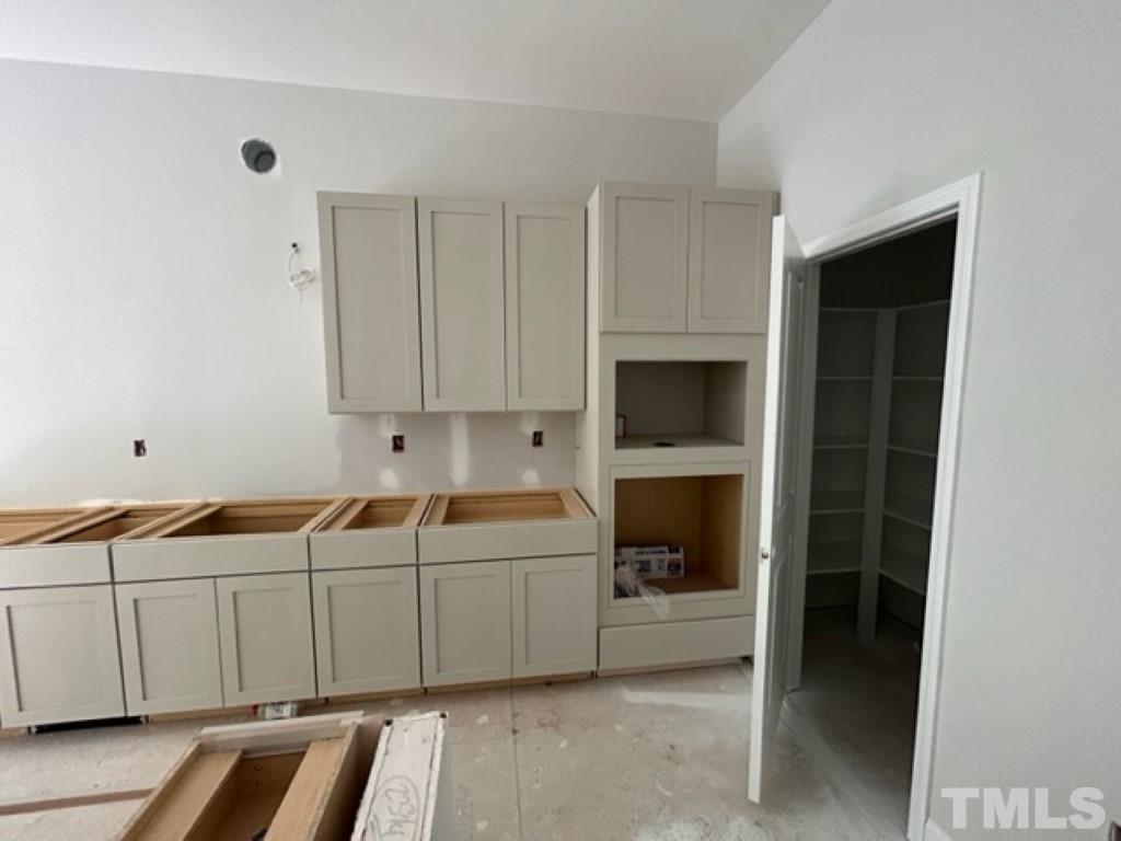 115 Cackling Way Zebulon, NC 27597 - Photo 5 of 44 a room with a bed and a fireplace