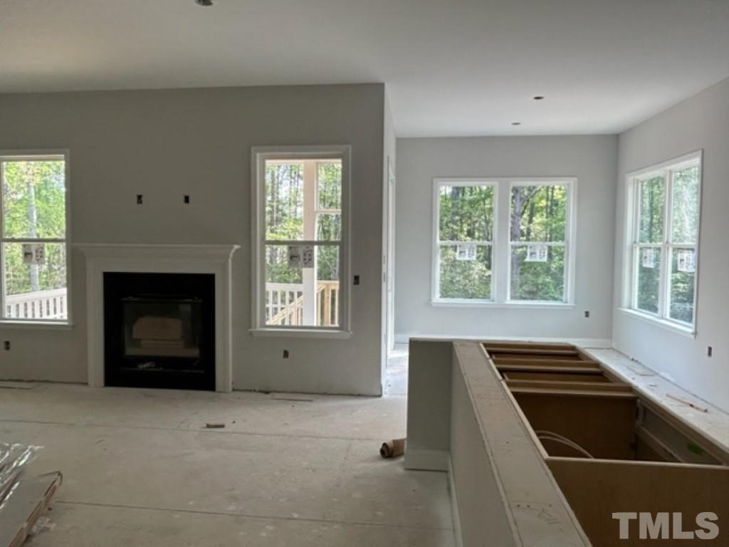 115 Cackling Way Zebulon, NC 27597 - Photo 7 of 44 a kitchen with an oven and a fireplace