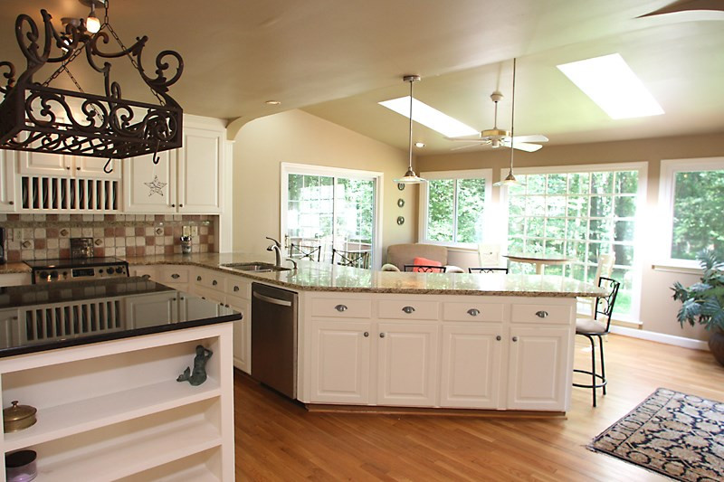 11823 Edgewater Court Raleigh, NC 27614 - Photo 4 of 19 Long granite counter with space for bar stools. Kitchen