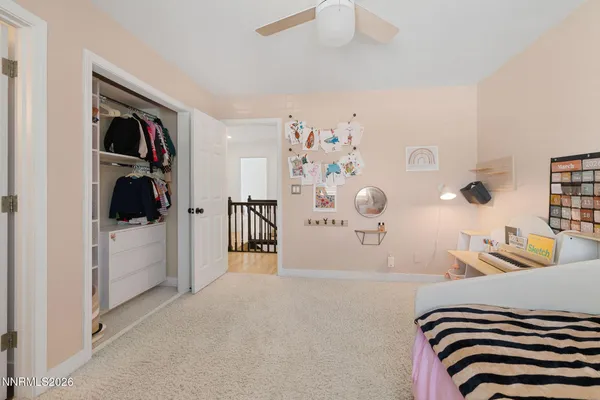 a bedroom with furniture and a window
