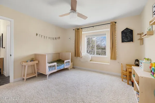 a bedroom with furniture and a window