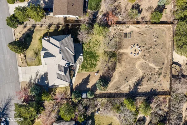 an aerial view of houses with yard