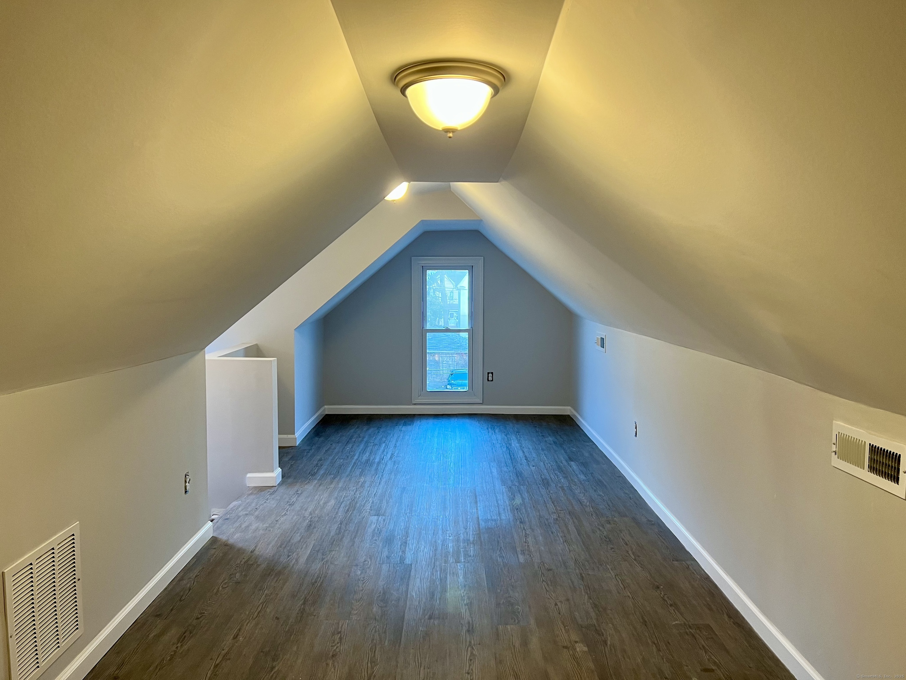 415 Hollister Avenue Bridgeport, CT 06607 - Photo 12 of 14 a view of a room with wooden floor