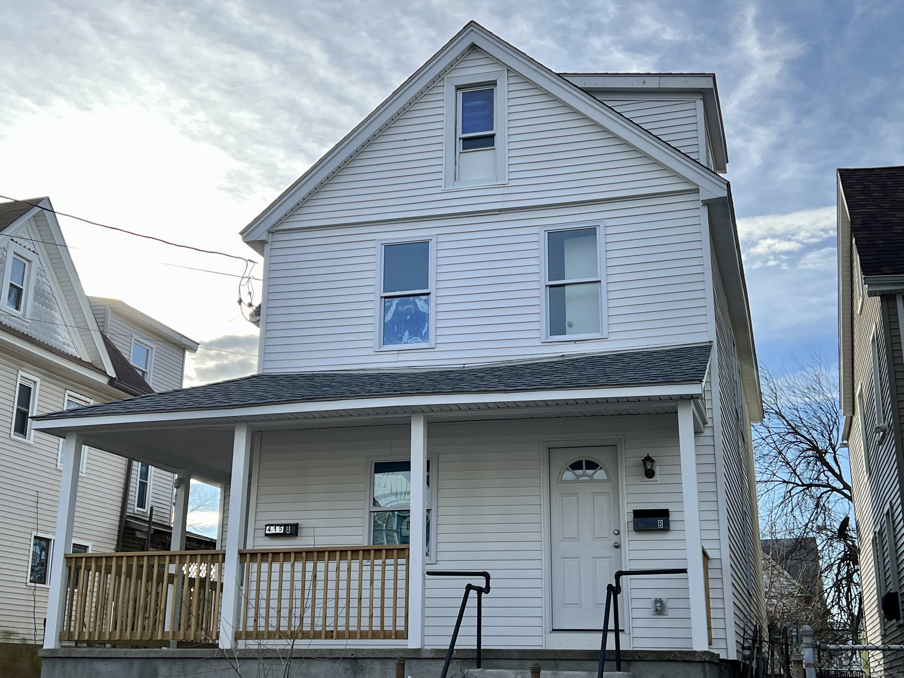 415 Hollister Avenue Bridgeport, CT 06607 - Photo 13 of 14 a front view of a house with garage