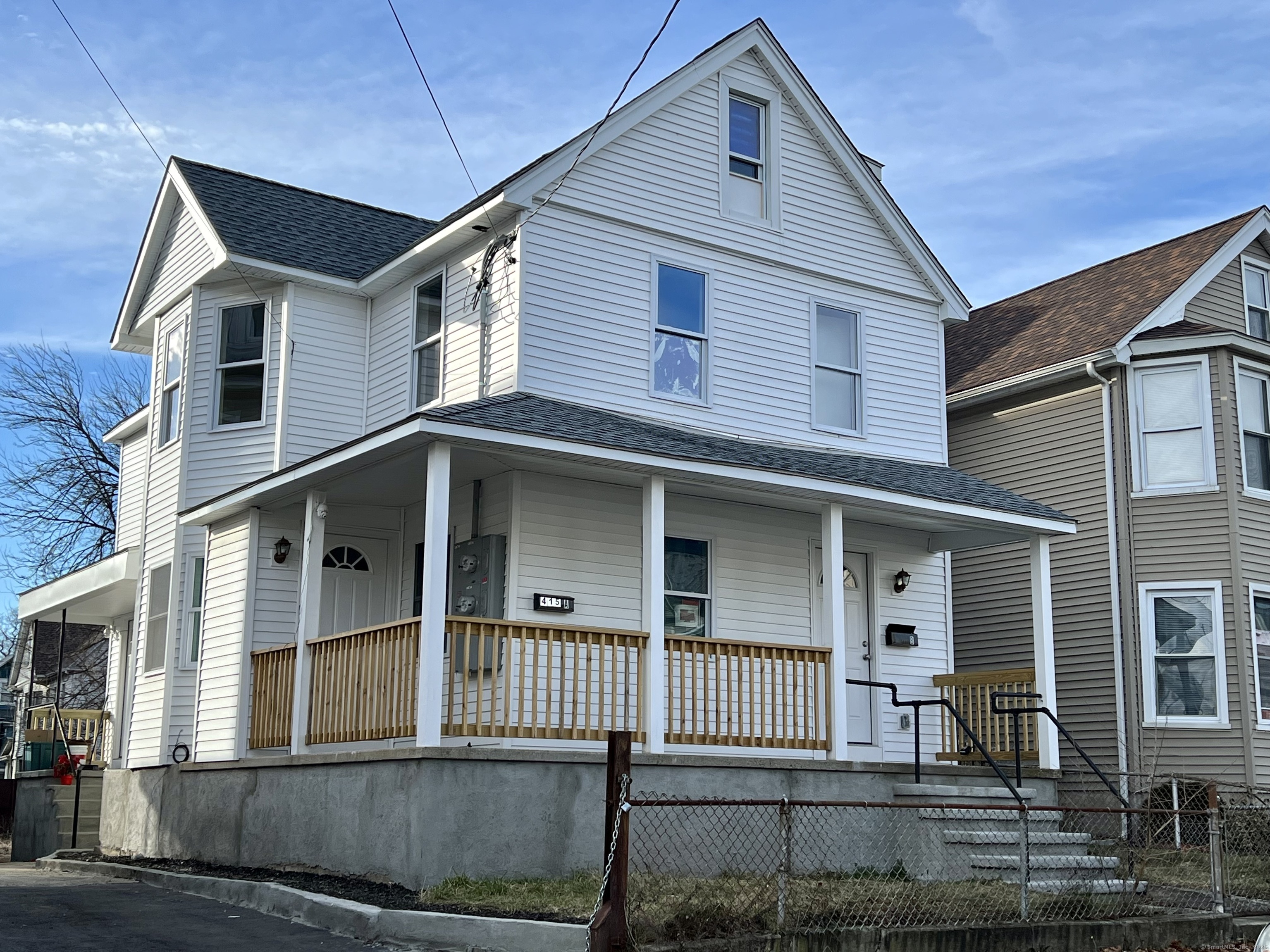 415 Hollister Avenue Bridgeport, CT 06607 - Photo 14 of 14 a front view of a house with a yard