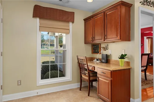a view of a kitchen with granite countertop a sink and cabinets