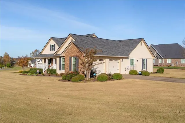 a front view of a house with a yard