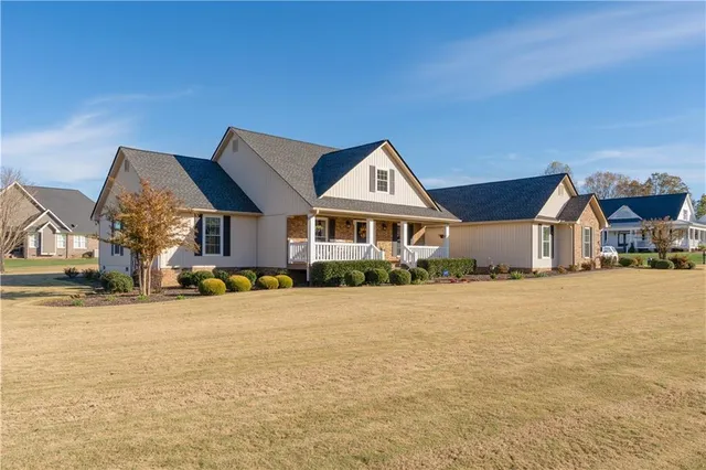 a front view of a house with a yard