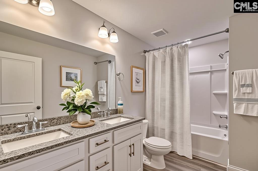 265 Eastover Road Eastover, SC 29044 - Photo 11 of 15 a bathroom with a granite countertop sink a toilet and shower