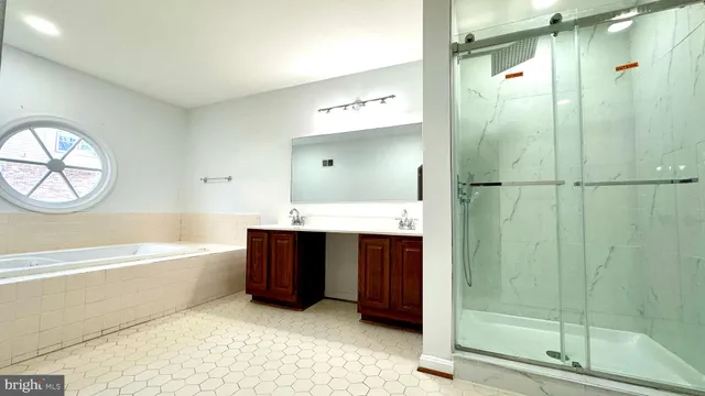 a view of a room with a ceiling fan and a window