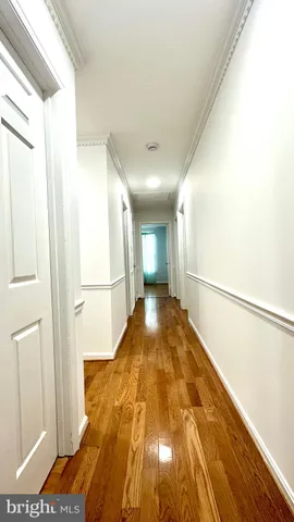 a view of front door with wooden cabinets