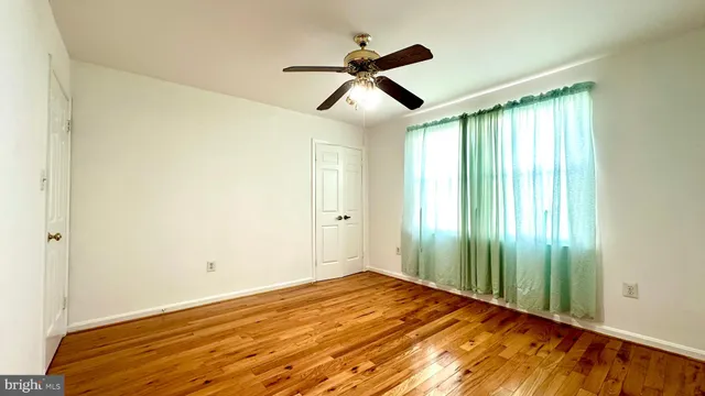 a bathroom with a toilet and a shower curtain