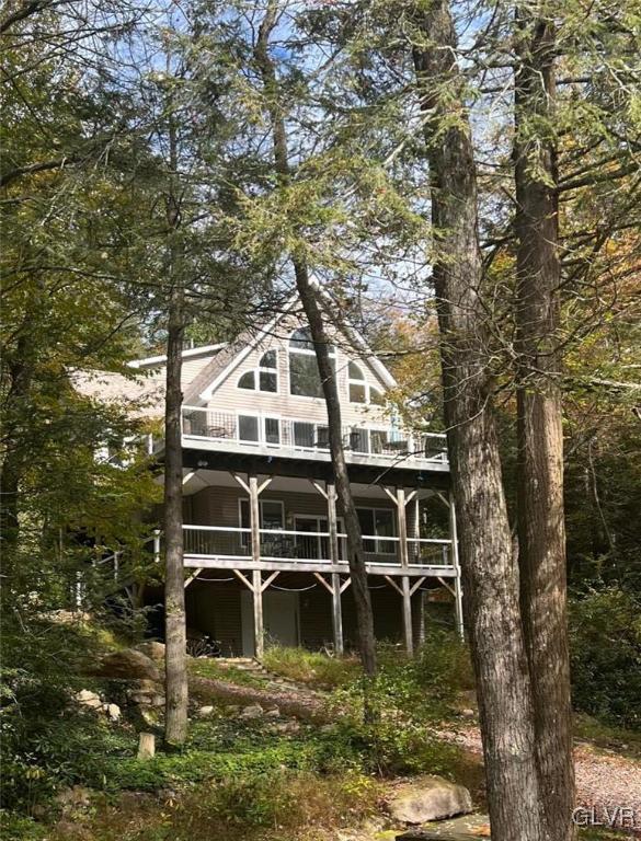 106 Stoney Creek Road Jim Thorpe, PA 18229 - Photo 1 of 50 a balcony with table and chairs