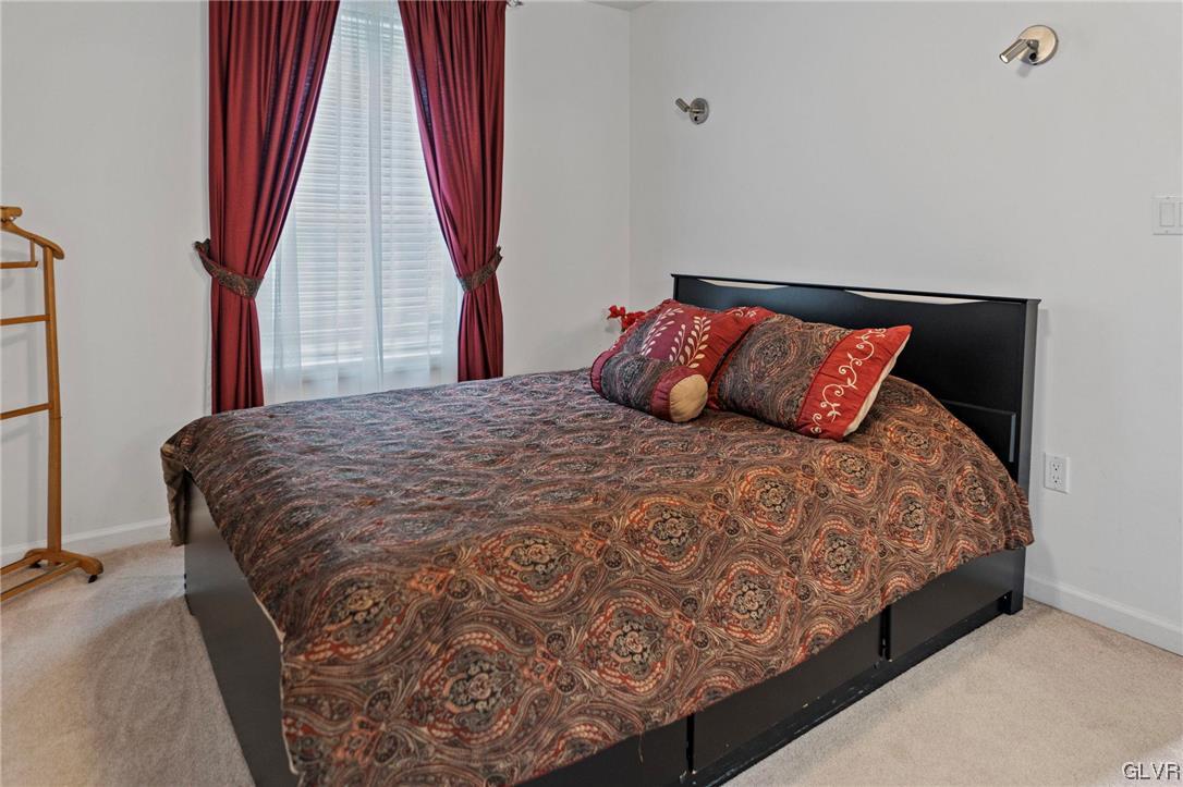 106 Stoney Creek Road Jim Thorpe, PA 18229 - Photo 13 of 50 a large bed sitting in a bedroom next to a window