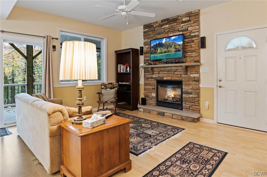 106 Stoney Creek Road Jim Thorpe, PA 18229 - Photo 22 of 50 a living room with furniture a flat screen tv and a fireplace